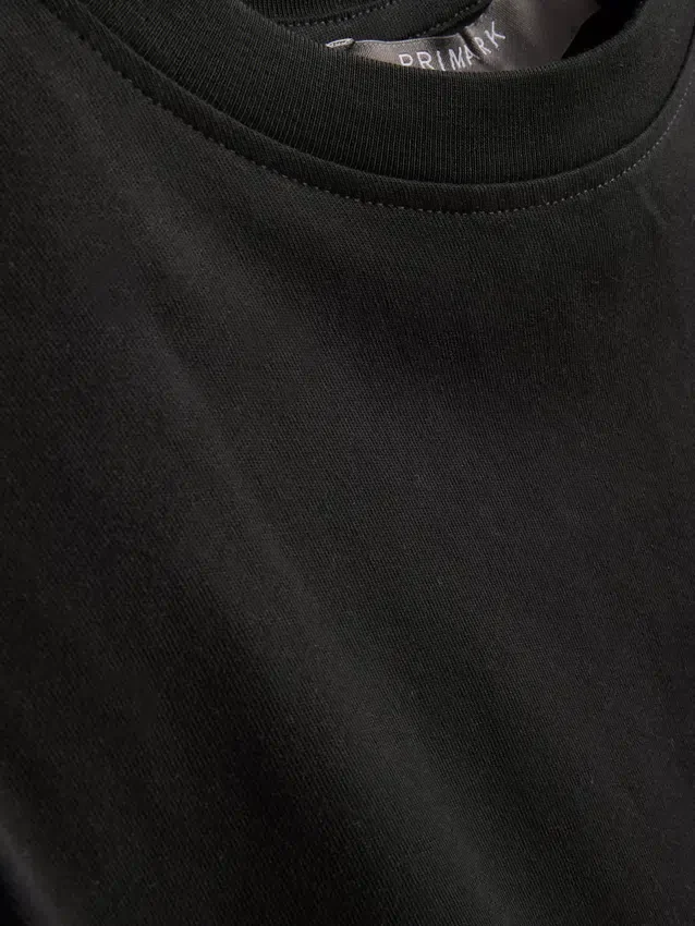 Ärmlös T-shirt med vadderade axlar
