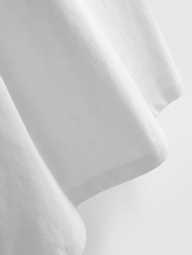 Ärmlös T-shirt med vadderade axlar