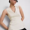 Ärmlös topp med V-ringning och peplum