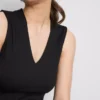 Ärmlös topp med V-ringning och peplum