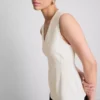 Ärmlös topp med V-ringning och peplum