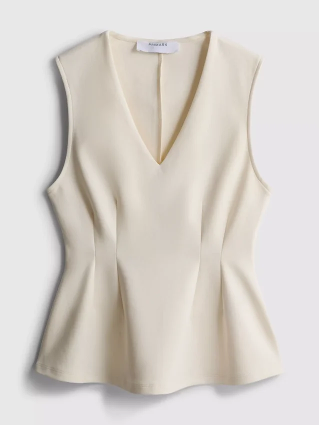 Ärmlös topp med V-ringning och peplum