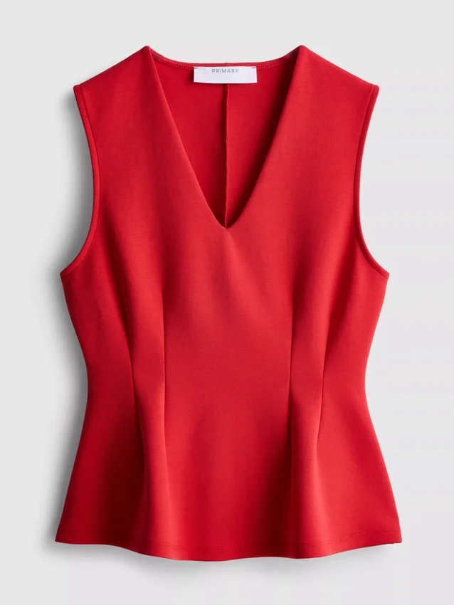Ärmlös topp med V-ringning och peplum