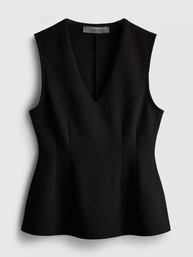 Ärmlös topp med V-ringning och peplum