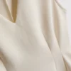 Ärmlös topp med V-ringning och peplum
