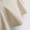 Ärmlös topp med V-ringning och peplum