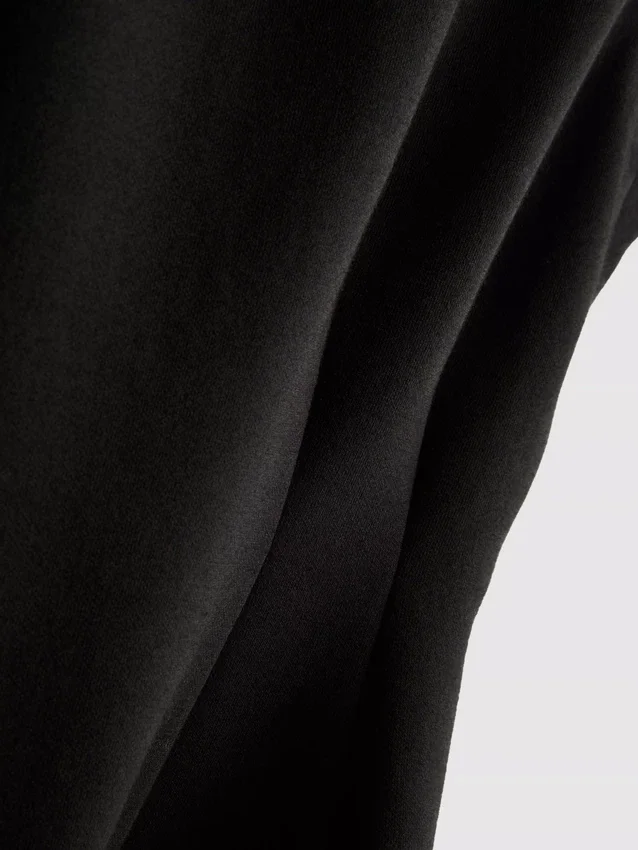 Ärmlös topp med V-ringning och peplum