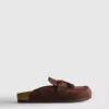 Sandaler i imitationsmocka med tofsar