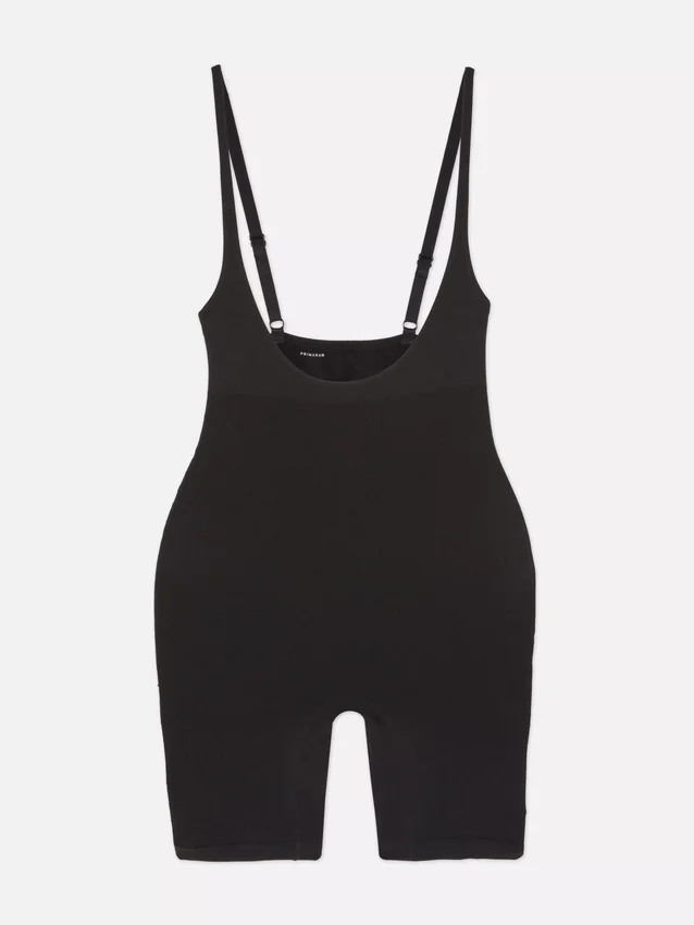 Shapewear bodysuit med öppen byst och längd till mitten av låret