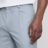 Slim fit-byxor i dobby-struktur