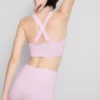 Sömlös aktiv crop-top med korsad rygg