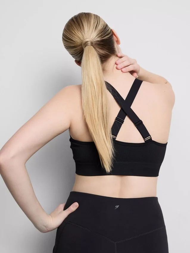 Sömlös aktiv crop-top med korsad rygg