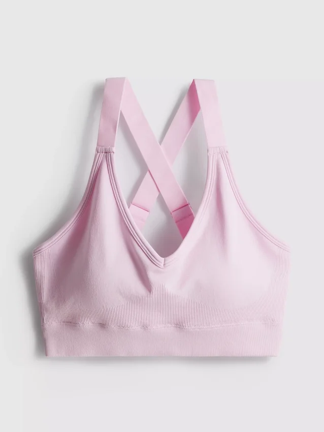 Sömlös aktiv crop-top med korsad rygg