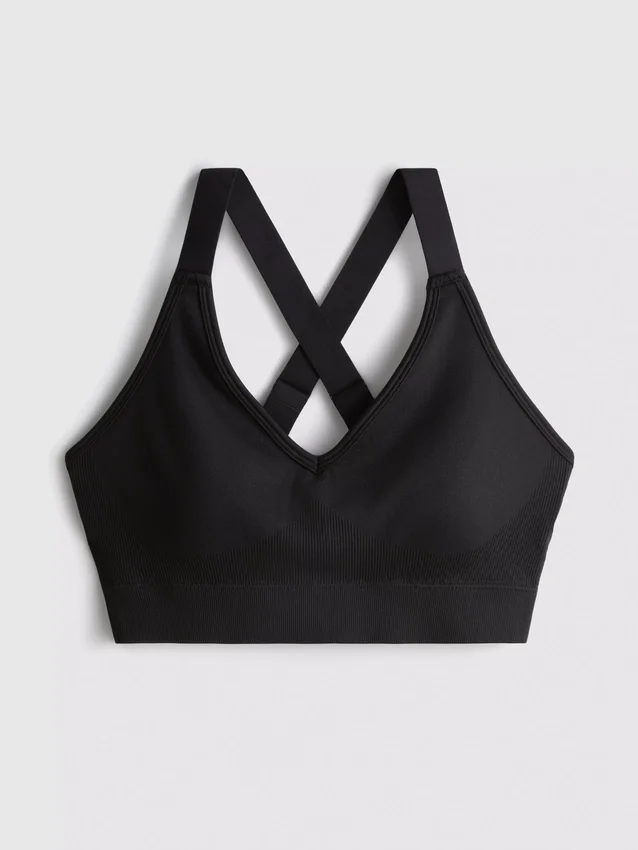 Sömlös aktiv crop-top med korsad rygg