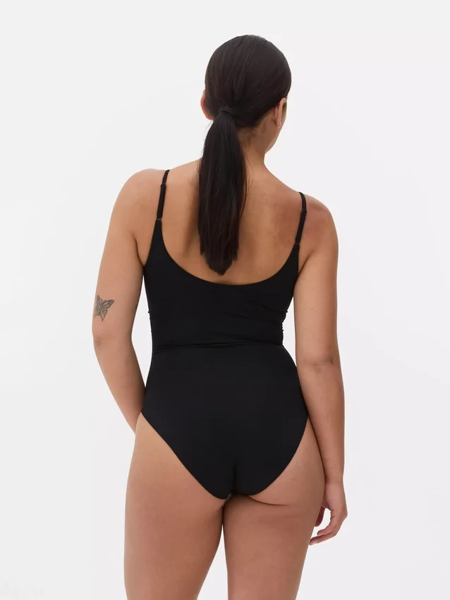 Sömlös, figursydd bodysuit