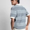 Strickad polotröja med strukturerade ränder
