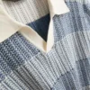 Strickad polotröja med strukturerade ränder