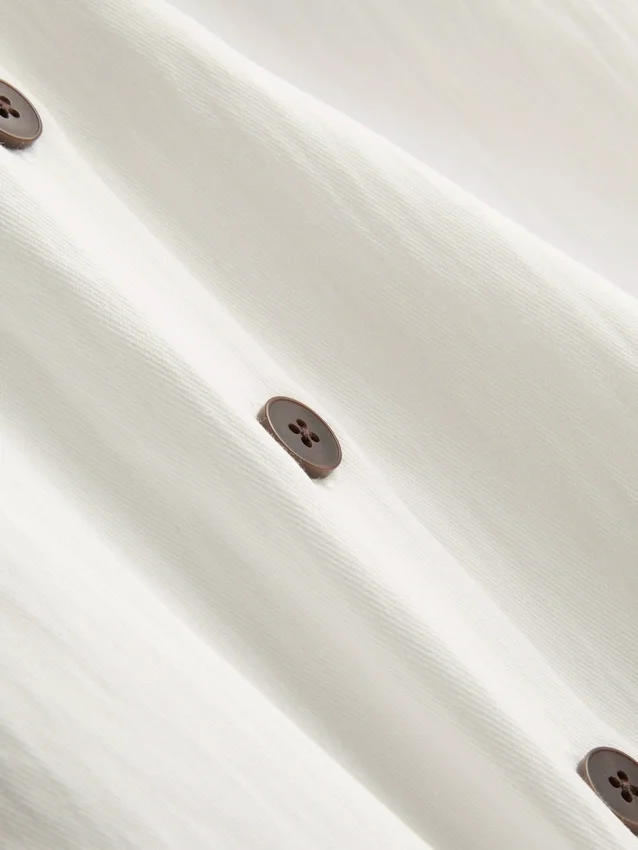 Strukturerad halterneck-top med knappar