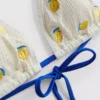 Strukturerad triangel-bikinitopp med citronmotiv
