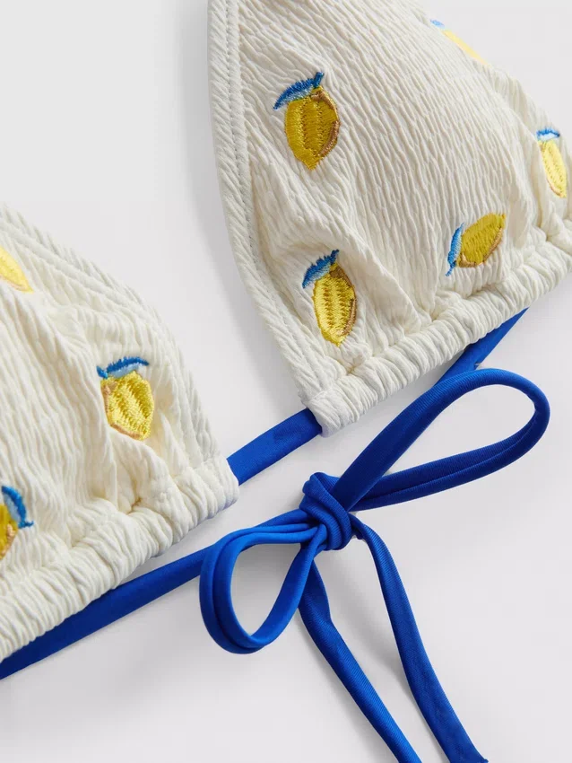 Strukturerad triangel-bikinitopp med citronmotiv