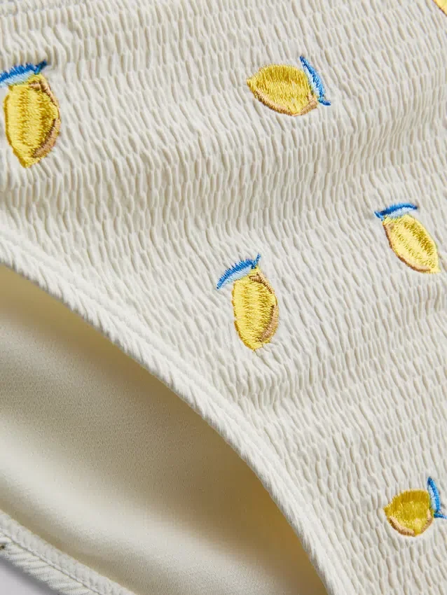 Strukturerade bikinibottnar i citrongult med knytband i sidorna