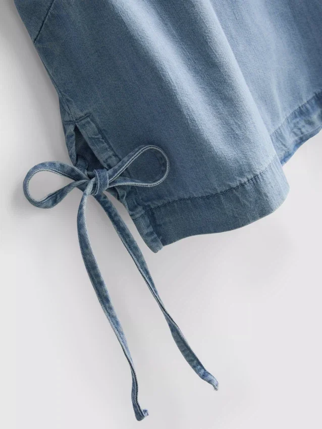 Tanktop i bomullsdenim med knytband i sidorna