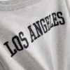 The Primark Scene | Sweatshirt med slogan och bar axel