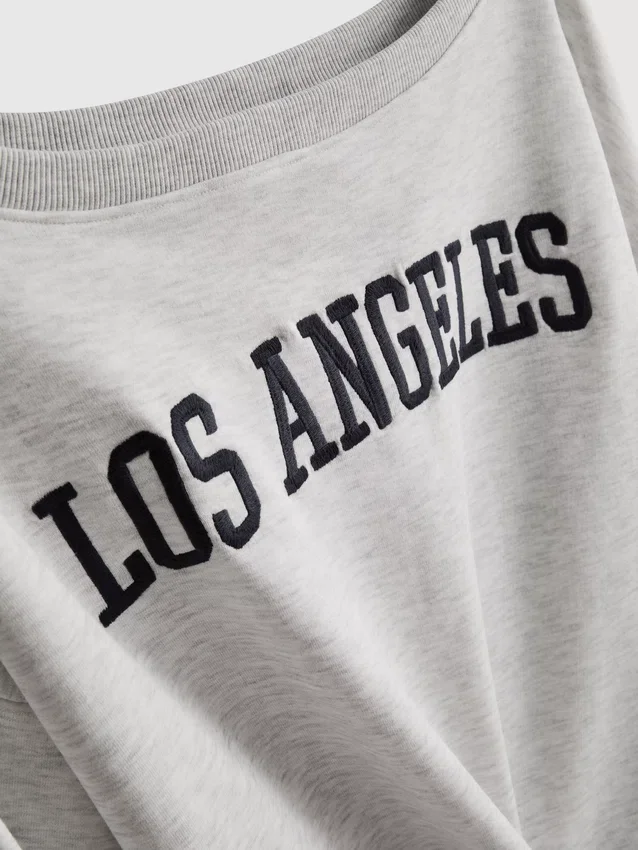 The Primark Scene | Sweatshirt med slogan och bar axel