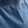 Träningsbyxor i bomullsdenim med vida ben