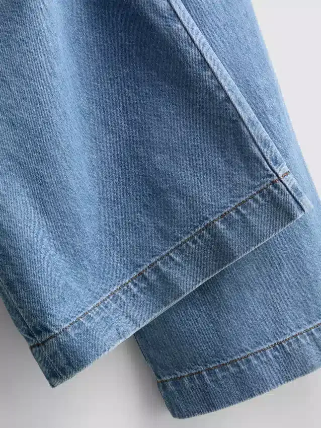 Träningsbyxor i bomullsdenim med vida ben