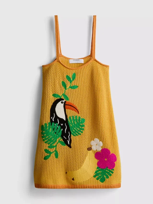 Virkad och broderad strandminiklänning