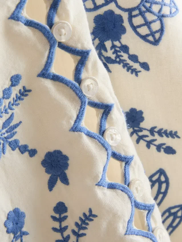 Väst i bomull med blommigt broderi