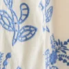 Väst i bomull med blommigt broderi